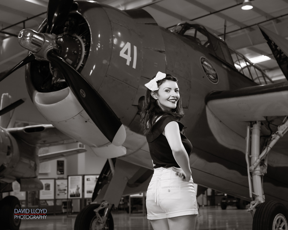 black and white woman standing in front of military plane in hanger, black and white photography, photography, photographer, photography workshop, workshop in atlanta, atlanta photography workshop