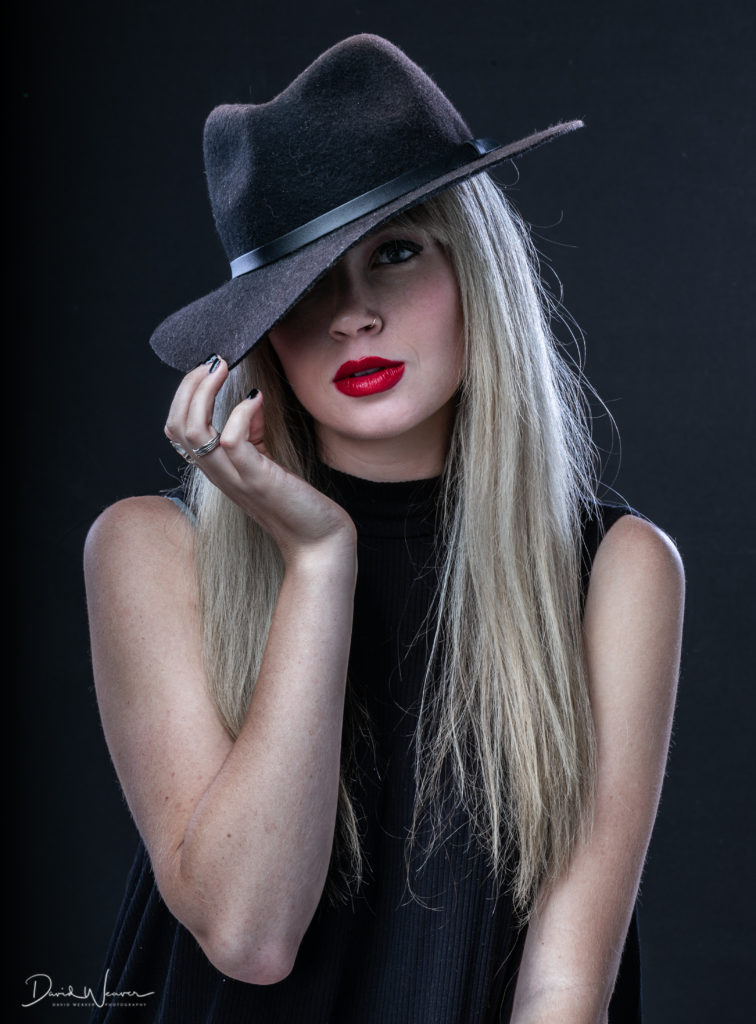 One of the student's photos of model in black top hat, portrait photography, fisheye connect, photography workshop, model workshop, studio workshop, photography studio, studio lighting, lighting workshop
